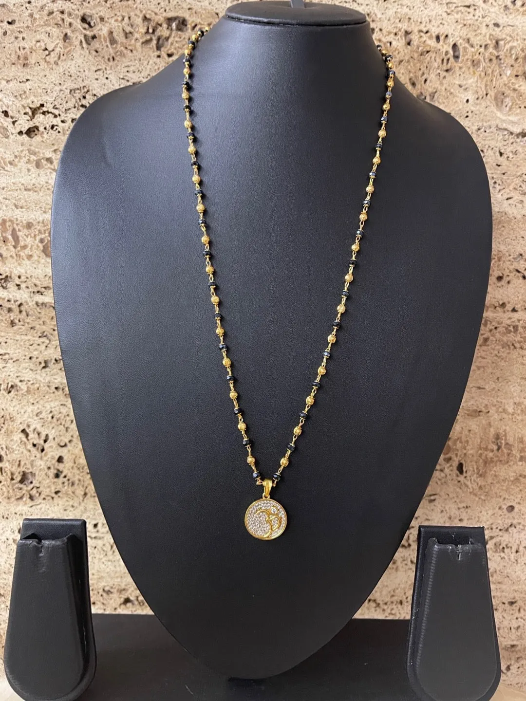 Modern Long Mangalsutra Designs American Diamond Om Pendant Crystal Gold And Black Beads Chain
